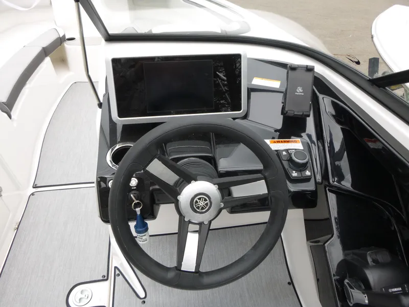Slide: The Image of 2025 Yamaha Boats AR250 dashboard with steering wheel and digital display. - 5