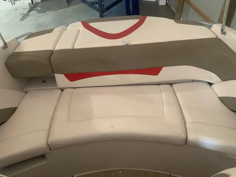 Slide: The Image of 2012 Glastron GLS 195 boat seating with beige and red upholstery. - 10