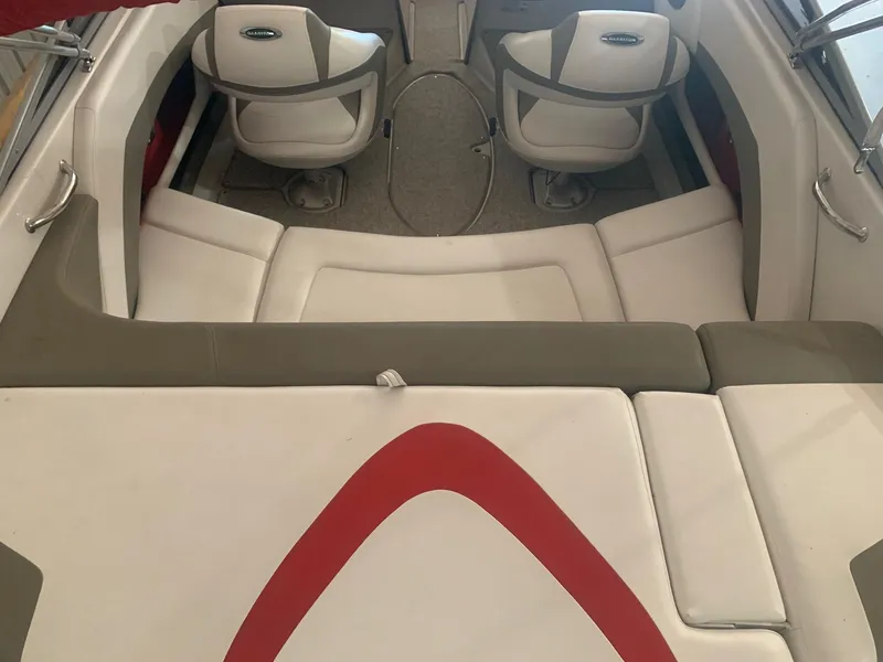 Slide: The Image of 2012 Glastron GLS 195 boat interior with white and red seating. - 12