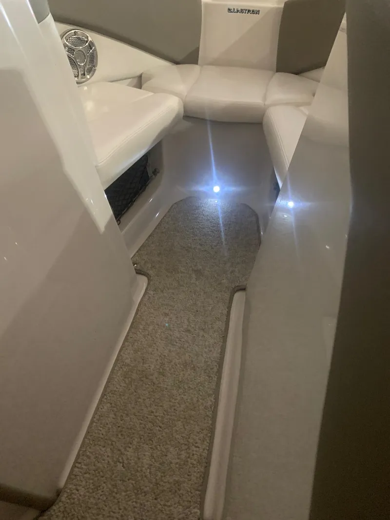 Slide: The Image of 2012 Glastron GLS 195 boat interior with seating and ambient lighting. - 19