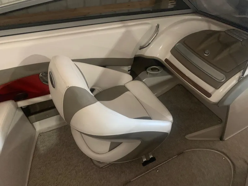 Slide: The Image of 2012 Glastron GLS 195 boat interior with white and gray seating. - 21