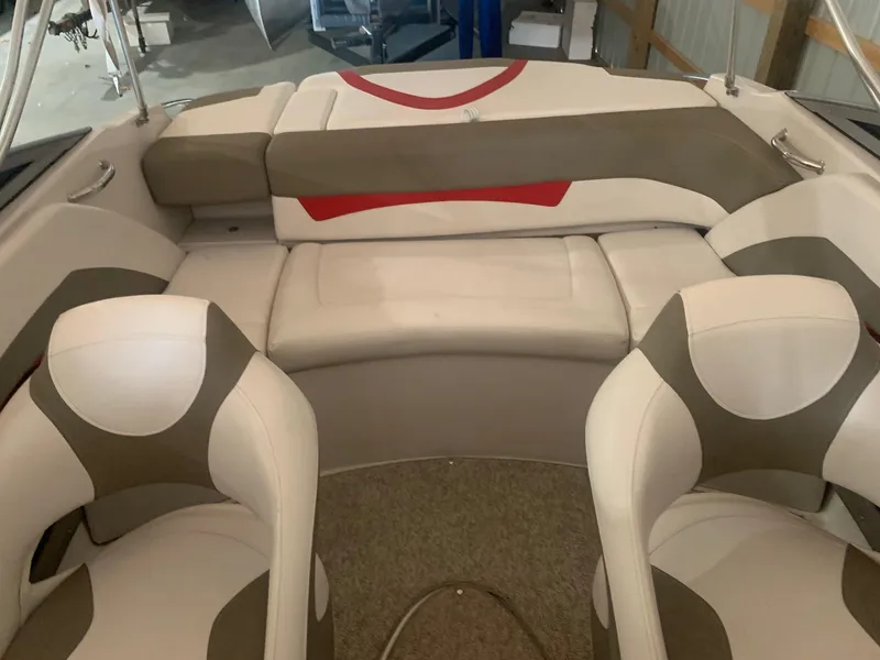 Slide: The Image of 2012 Glastron GLS 195 boat interior with beige and white seating. - 24