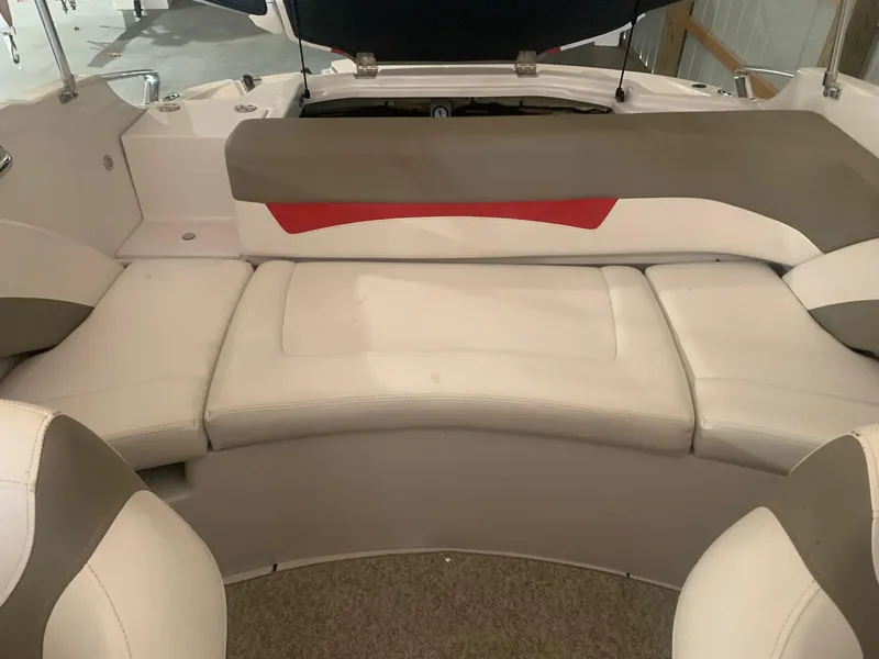 Slide: The Image of 2012 Glastron GLS 195 boat interior with beige seating and red accents. - 25