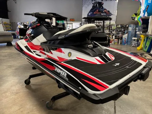 Slide: The Image of 2017 Yamaha WaveRunner EX in showroom, featuring sleek red and black design. - 5