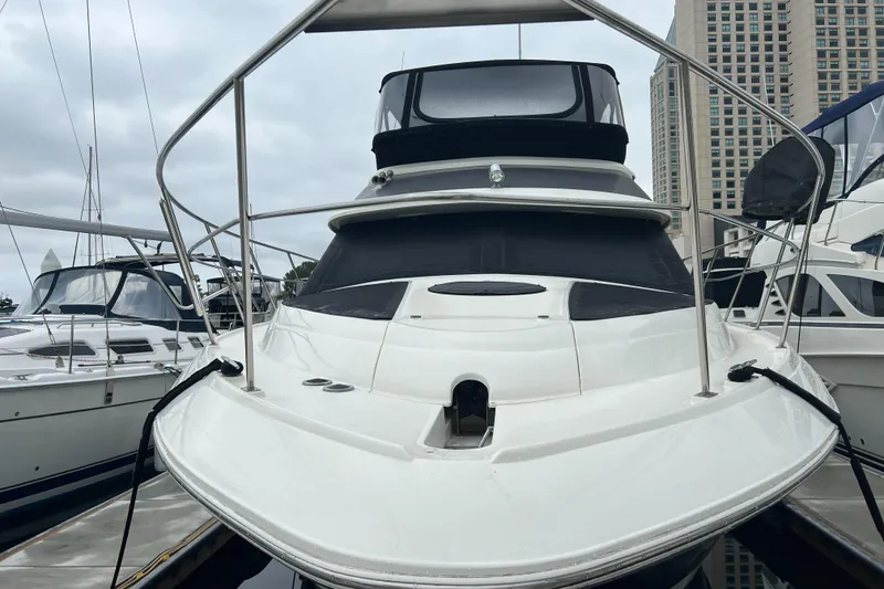 Slide: The Image of 1995 Cruisers Yachts 3650 ACMY docked, showcasing sleek design and spacious deck. - 16