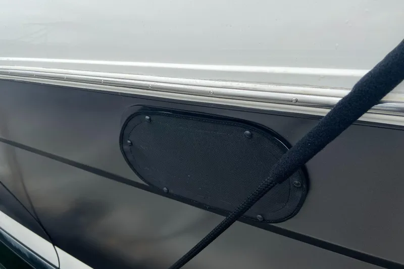 Slide: The Image of Close-up of 1995 Cruisers Yachts 3650 ACMY hull with black oval detail. - 17