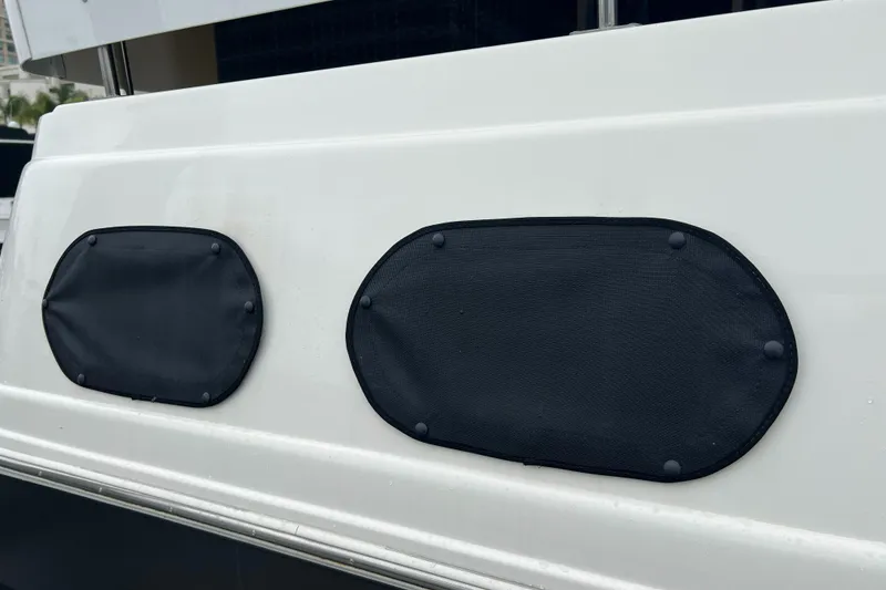 Slide: The Image of 1995 Cruisers Yachts 3650 ACMY boat with black oval window covers. - 18