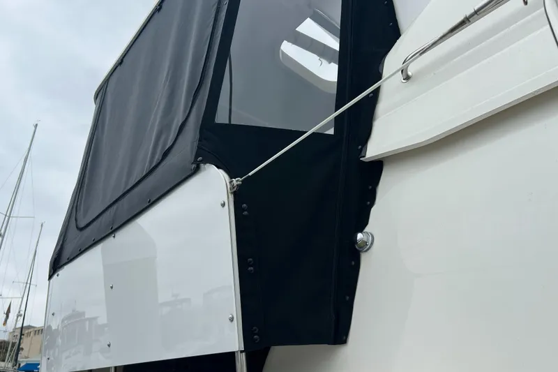 Slide: The Image of 1995 Cruisers Yachts 3650 ACMY with black canvas enclosure detail. - 27