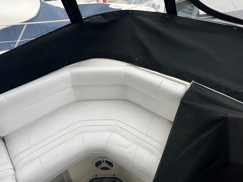 Slide: The Image of 1995 Cruisers Yachts 3650 ACMY interior with white seating and black trim. - 35