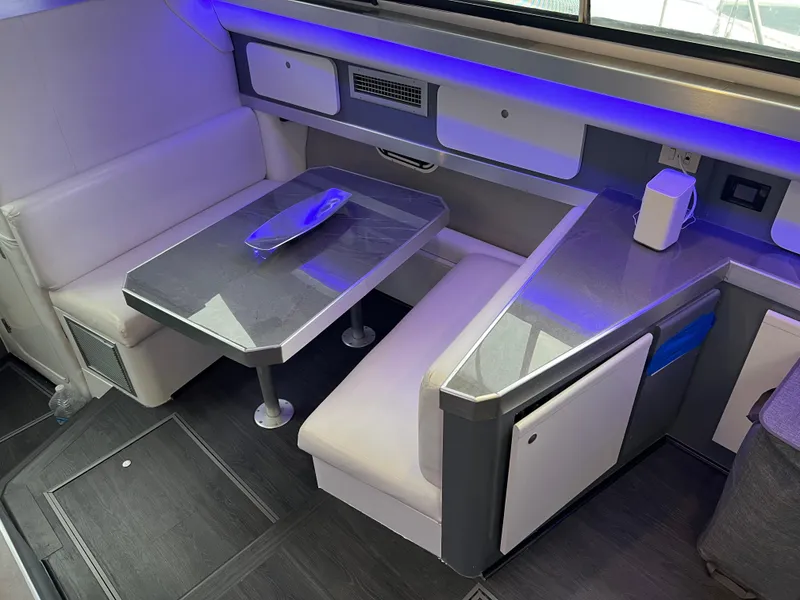 Slide: The Image of 1995 Cruisers Yachts 3650 ACMY interior with modern seating and ambient lighting. - 38