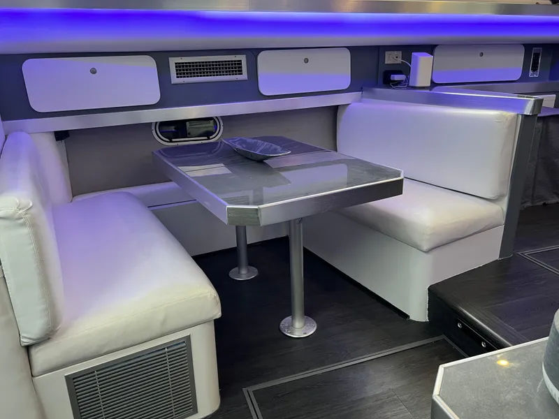 Slide: The Image of 1995 Cruisers Yachts 3650 ACMY interior with modern dining area and ambient lighting. - 41
