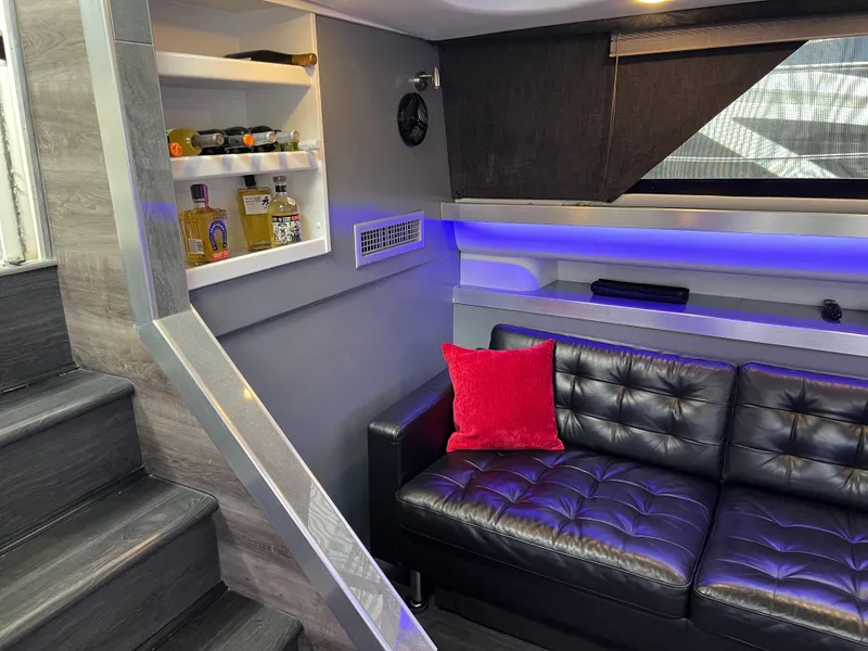 Slide: The Image of Luxurious interior of 1995 Cruisers Yachts 3650 ACMY with leather seating and ambient lighting. - 47