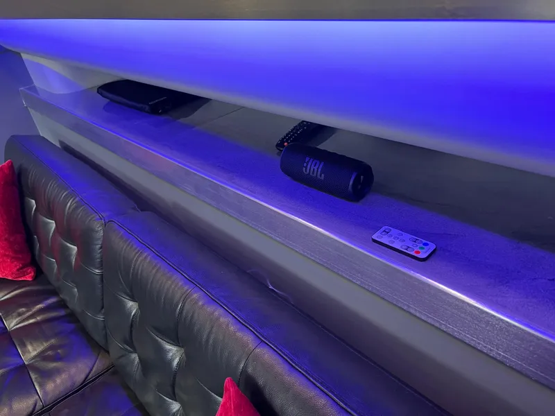 Slide: The Image of Luxurious interior of 1995 Cruisers Yachts 3650 ACMY with blue LED lighting and leather seating. - 49