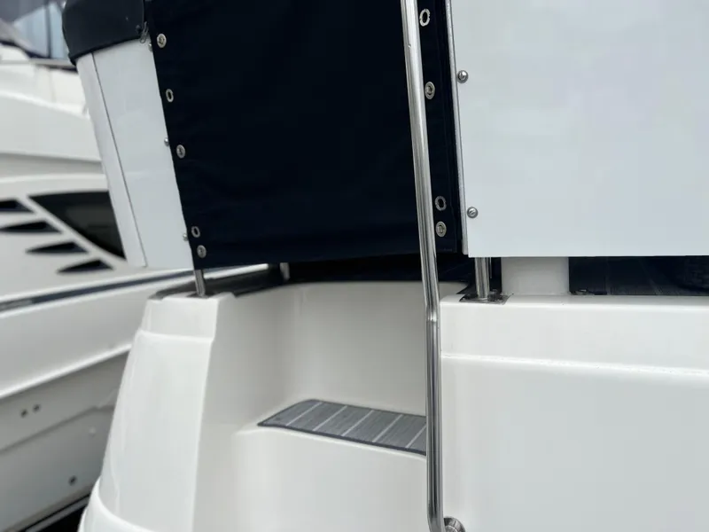 Slide: The Image of 1995 Cruisers Yachts 3650 ACMY, rear deck view with stainless steel railing. - 11