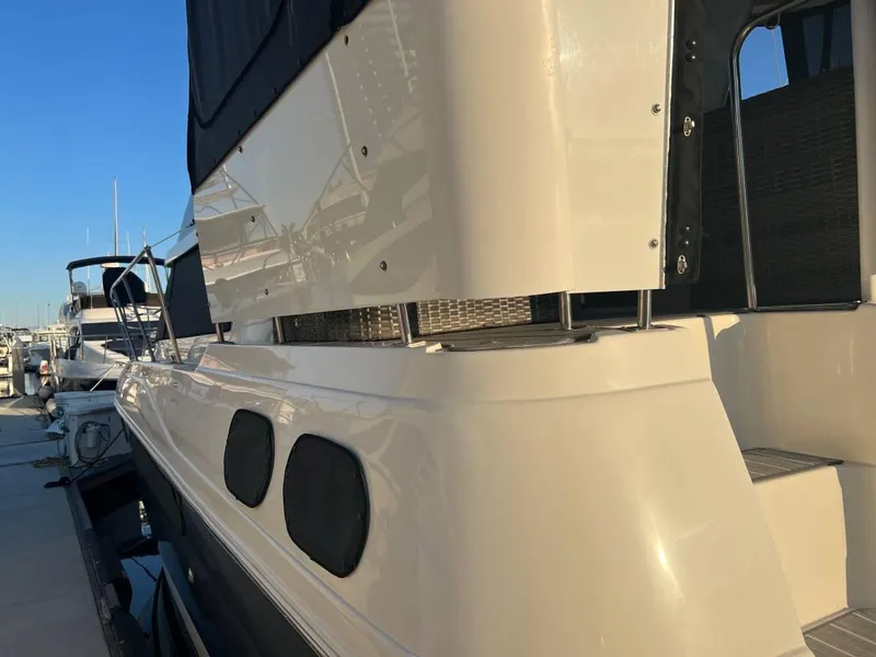 Slide: The Image of 1995 Cruisers Yachts 3650 ACMY docked, showcasing sleek design and modern features. - 12