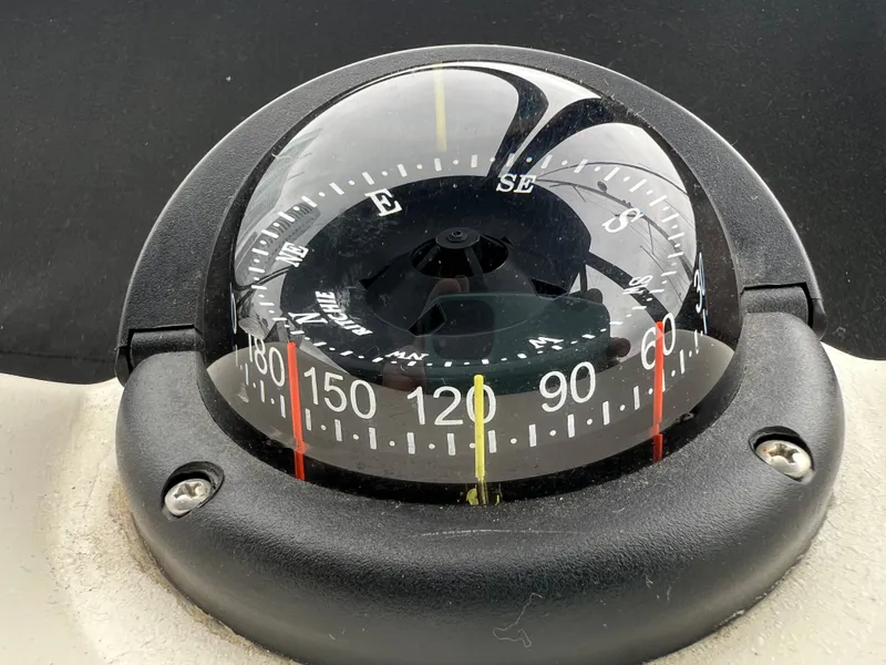 Slide: The Image of Compass on 1995 Cruisers Yachts 3650 ACMY, showing cardinal directions and degrees. - 34