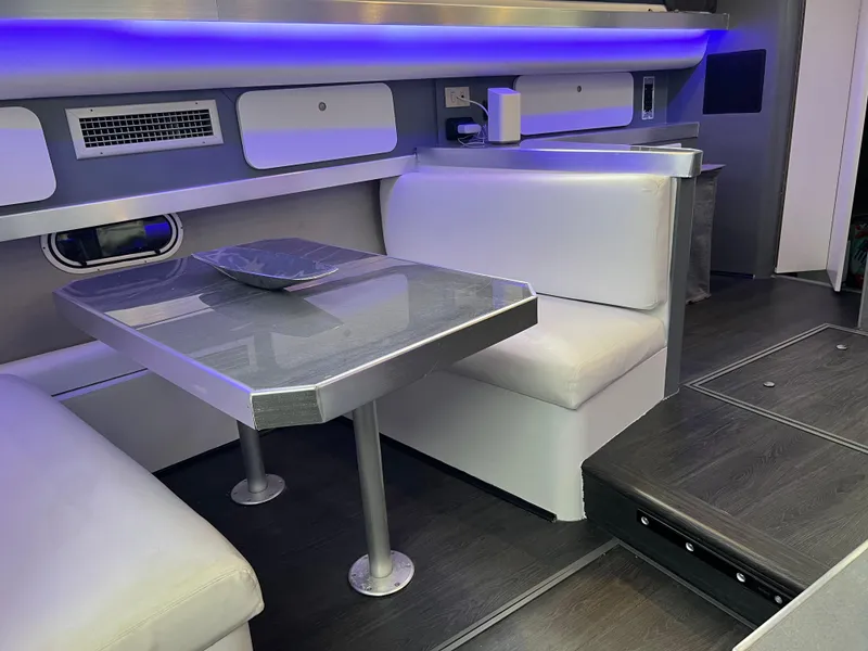 Slide: The Image of Interior of 1995 Cruisers Yachts 3650 ACMY with modern seating and ambient lighting. - 42
