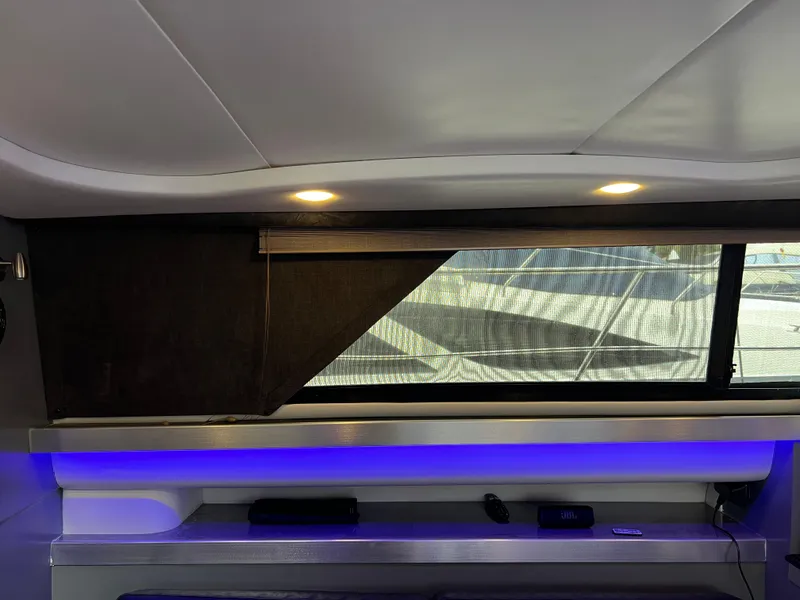 Slide: The Image of Interior of 1995 Cruisers Yachts 3650 ACMY with modern lighting and window view. - 45