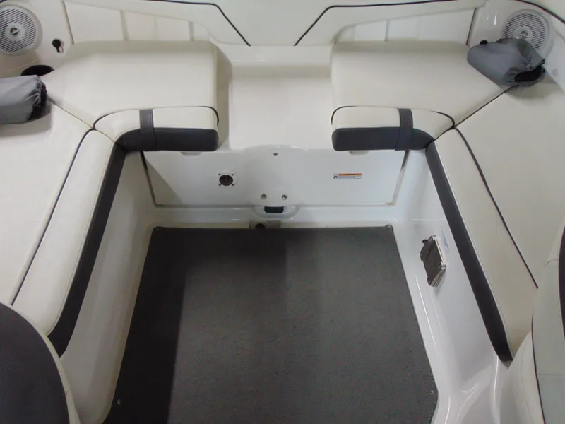 Slide: The Image of 2014 Yamaha Boats SX210 interior seating area with cushioned seats and speakers. - 11