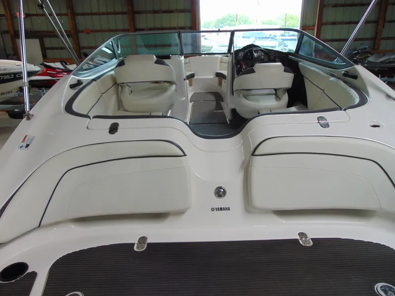 Slide: The Image of 2014 Yamaha Boats SX210 interior view in a storage facility. - 5