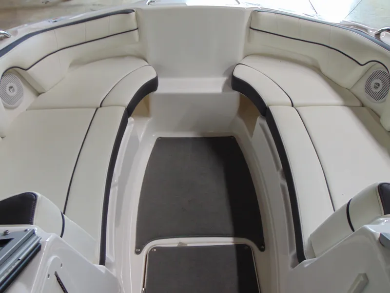 Slide: The Image of 2014 Yamaha SX210 boat interior with white cushioned seating and speakers. - 9