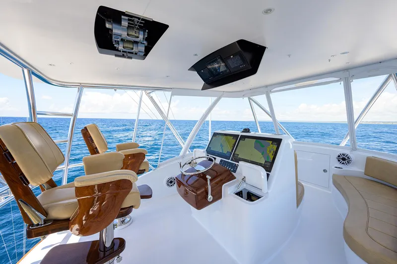 Slide: The Image of Interior of 2022 F&S 58 Custom Carolina yacht with helm and seating, overlooking ocean. - 15