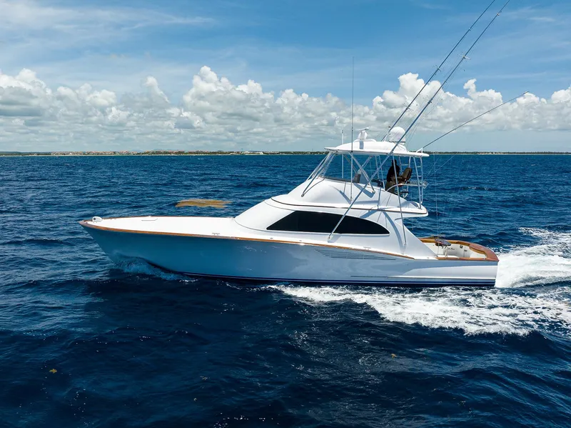 Slide: The Image of 2022 F&S 58 Custom Carolina yacht cruising on open ocean under clear skies. - 2