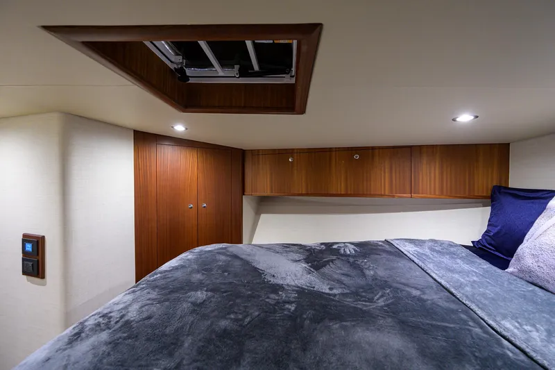 Slide: The Image of Luxurious cabin interior of 2022 F&S 58 Custom Carolina yacht with wood accents. - 20