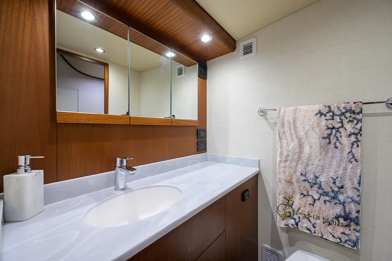 Slide: The Image of Luxurious bathroom in 2022 F&S 58 Custom Carolina yacht with modern fixtures and elegant design. - 26