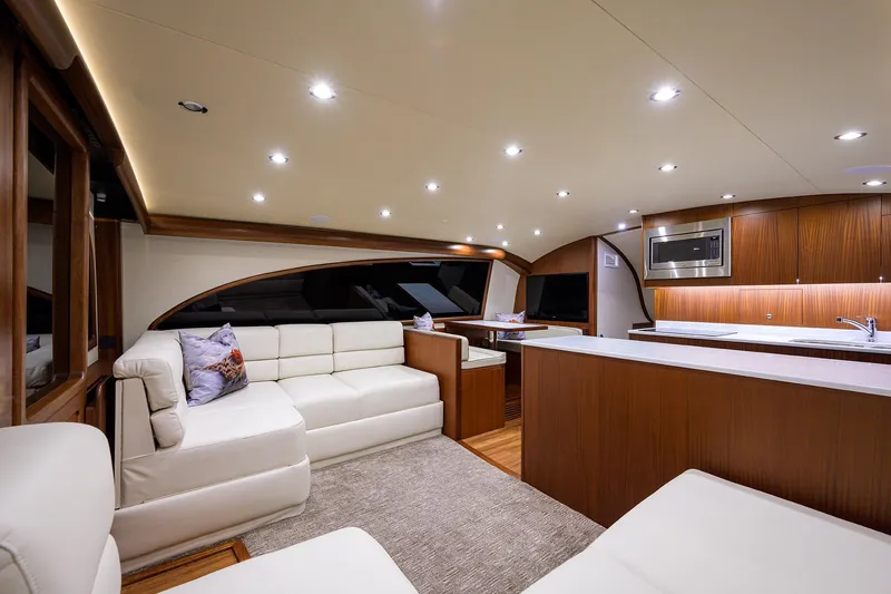 Slide: The Image of Luxurious interior of 2022 F&S 58 Custom Carolina yacht with modern furnishings and ambient lighting. - 33