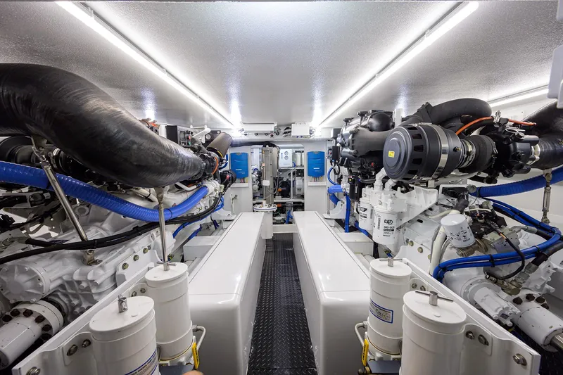 Slide: The Image of Engine room of 2022 F&S 58 Custom Carolina yacht, featuring advanced machinery and systems. - 36