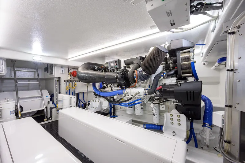 Slide: The Image of Engine room of 2022 F&S 58 Custom Carolina yacht, showcasing advanced mechanical systems. - 37