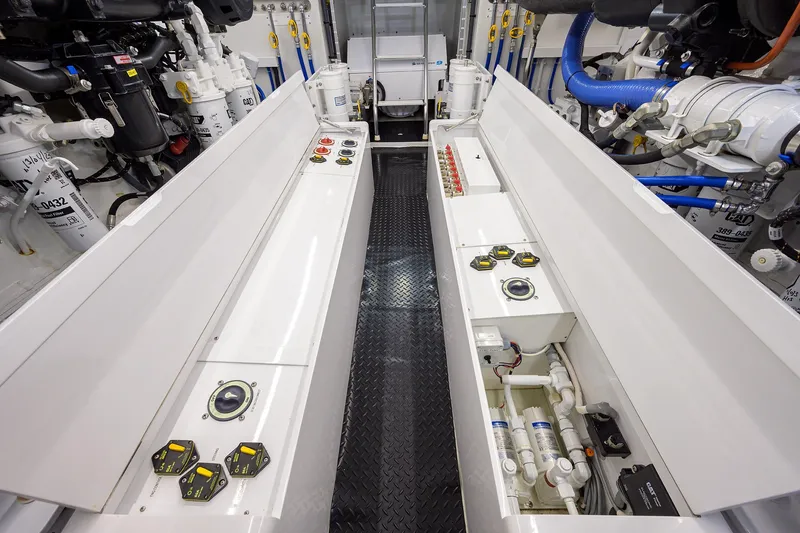 Slide: The Image of Engine room of 2022 F&S 58 Custom Carolina yacht, showcasing advanced machinery and controls. - 38
