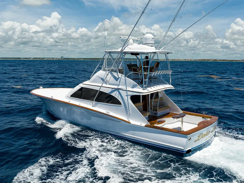 Slide: The Image of 2022 F&S 58 Custom Carolina yacht cruising on open ocean under clear skies. - 4