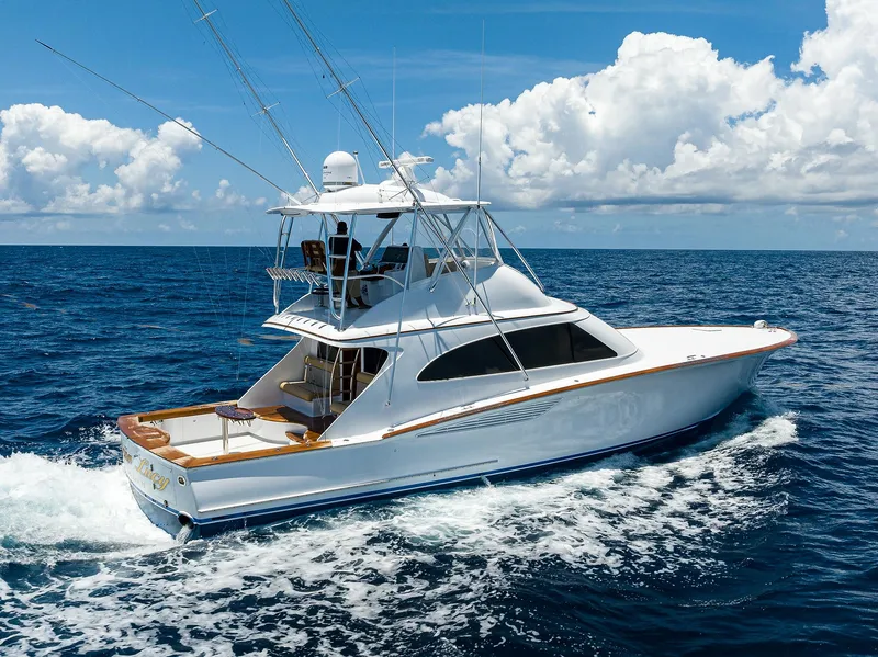 Slide: The Image of 2022 F&S 58 Custom Carolina yacht cruising on open ocean under blue sky. - 5