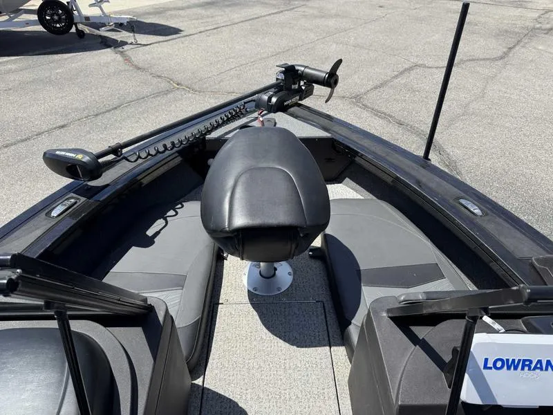 Slide: The Image of 2023 Tracker Targa 18 boat interior with seating and fishing equipment. - 11