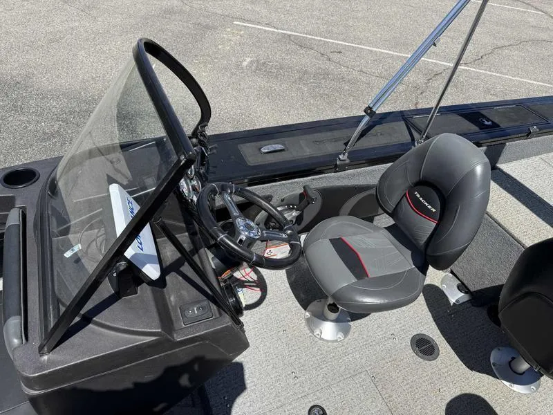 Slide: The Image of 2023 Tracker Targa 18 boat interior with steering console and seating. - 3