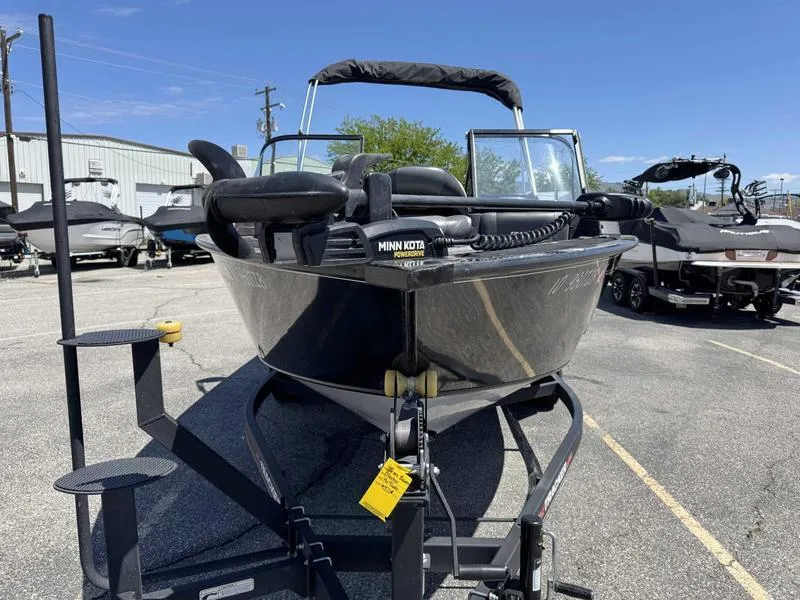 Slide: The Image of 2023 Tracker Targa 18 boat on trailer, equipped with Minn Kota trolling motor. - 8