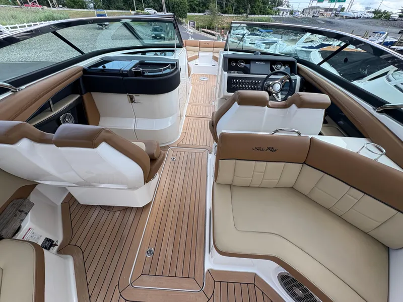 Slide: The Image of 2015 Sea Ray 350 SLX boat interior with luxurious seating and modern dashboard. - 13