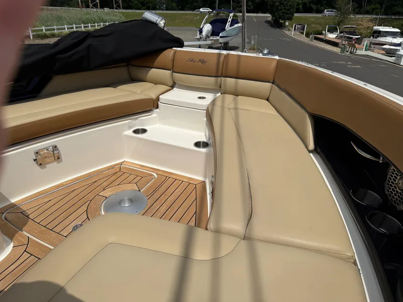 Slide: The Image of 2015 Sea Ray 350 SLX boat interior with tan seating and teak flooring. - 18