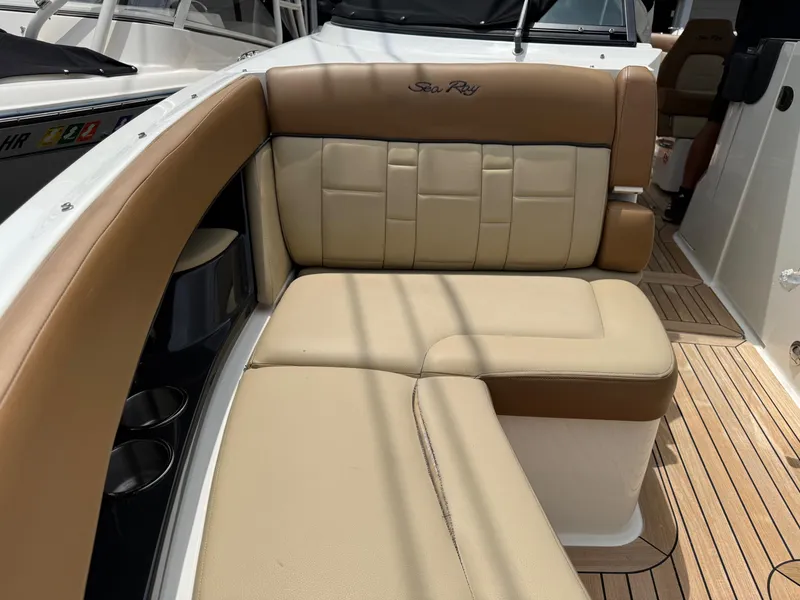 Slide: The Image of Luxurious seating on a 2015 Sea Ray 350 SLX boat with tan upholstery. - 20