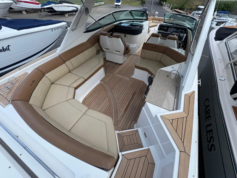 Slide: The Image of 2015 Sea Ray 350 SLX boat with spacious seating and elegant interior design. - 7