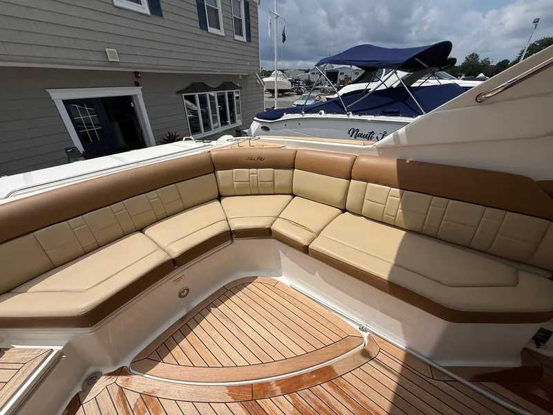 Slide: The Image of Luxurious seating on a 2015 Sea Ray 350 SLX boat with teak flooring. - 9