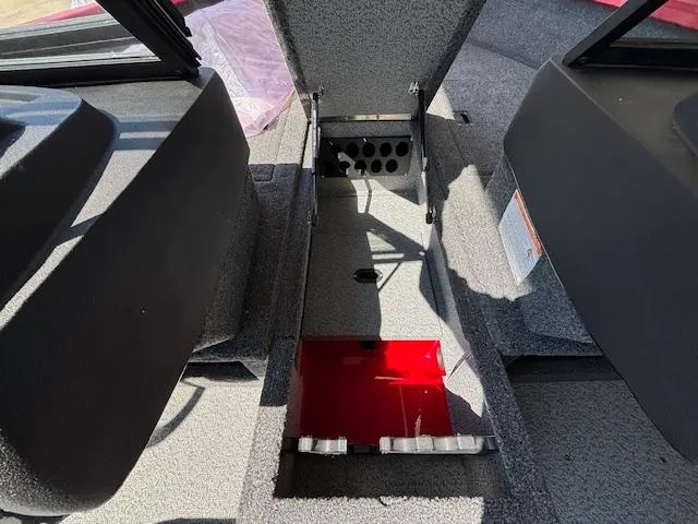 Slide: The Image of Interior view of 2025 Crestliner 1750 Hawk boat, showcasing storage compartment. - 12