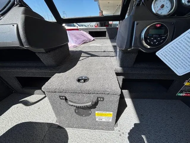 Slide: The Image of Interior of 2025 Crestliner 1750 Hawk boat, featuring dashboard and seating area. - 13