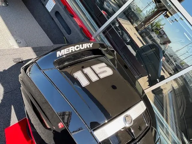Slide: The Image of Mercury 115 outboard motor on 2025 Crestliner 1750 Hawk boat, reflecting in glass. - 19
