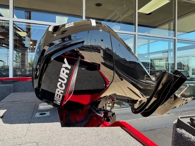 Slide: The Image of 2025 Crestliner 1750 Hawk with Mercury outboard motor, displayed in a showroom. - 20