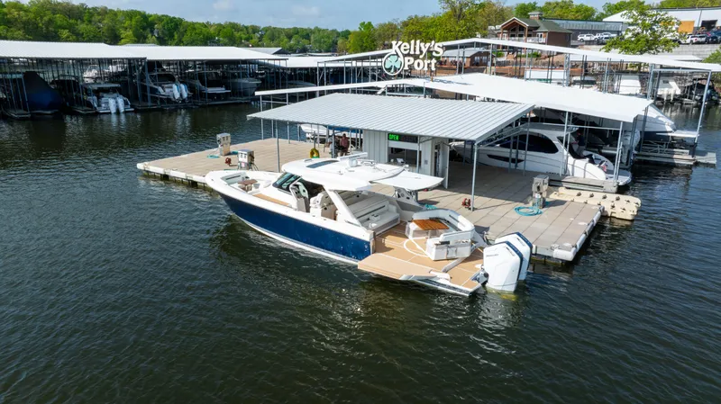 Slide: The Image of 2024 Tiara Yachts 43 LS docked at Kelly's Port marina. - 10