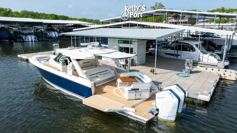 Slide: The Image of 2024 Tiara Yachts 43 LS docked at Kelly's Port marina. - 11