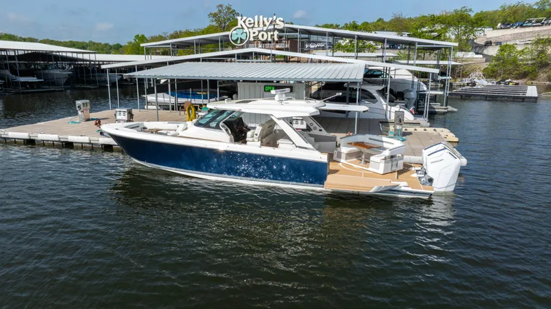 Slide: The Image of 2024 Tiara Yachts 43 LS docked at Kelly's Port marina. - 14